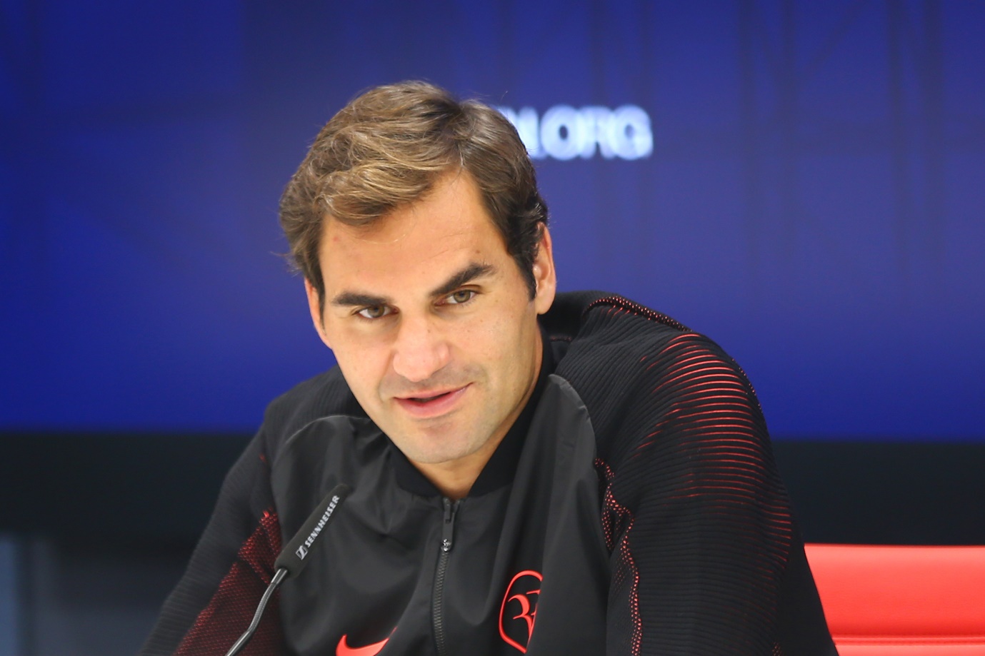 a-picture-containing-person-indoor-description-a Credit Suisse brand ambassador Roger Federer at a press conference